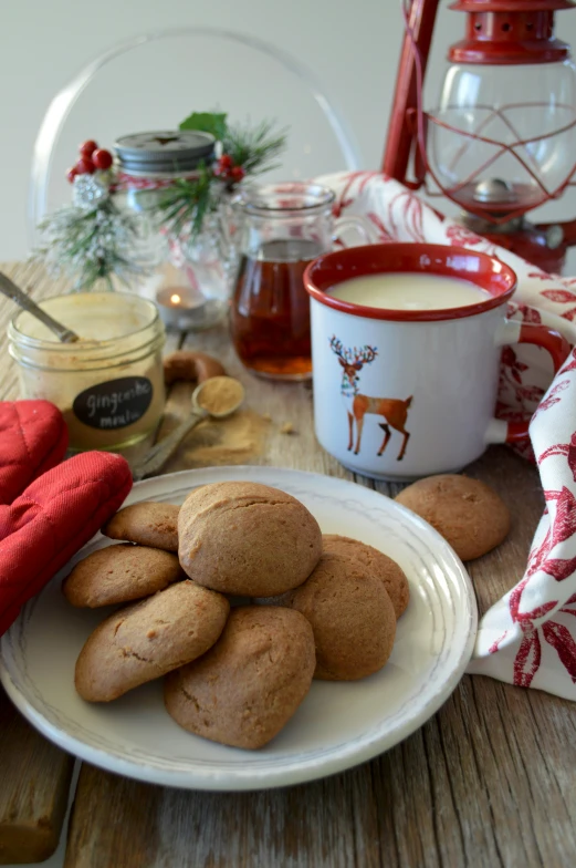 a plate full of cookies next to a coffee cup