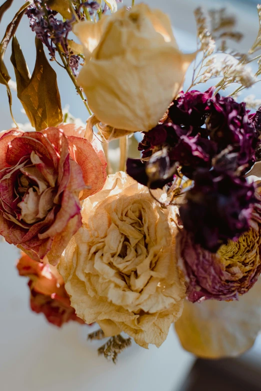 a close up of a vase with flowers