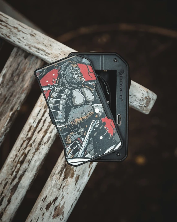 a case holding an electronic device sitting on top of a wooden table