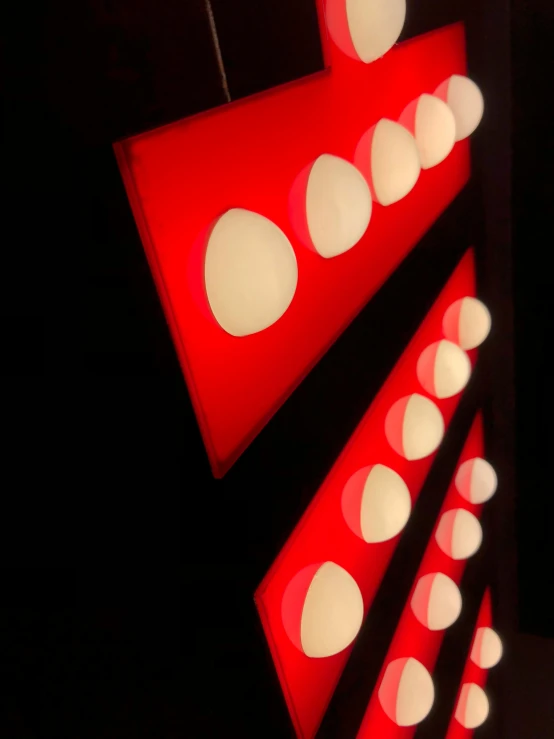 an abstractly designed display with circular holes on it