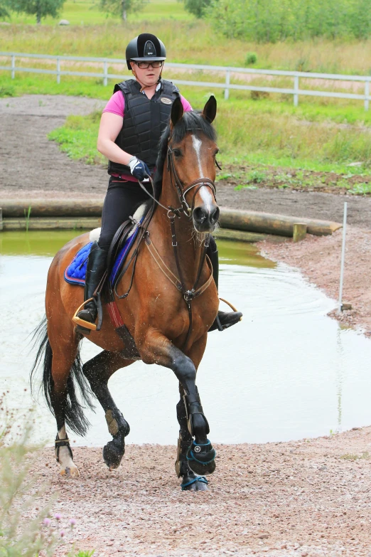 a woman that is sitting on a horse