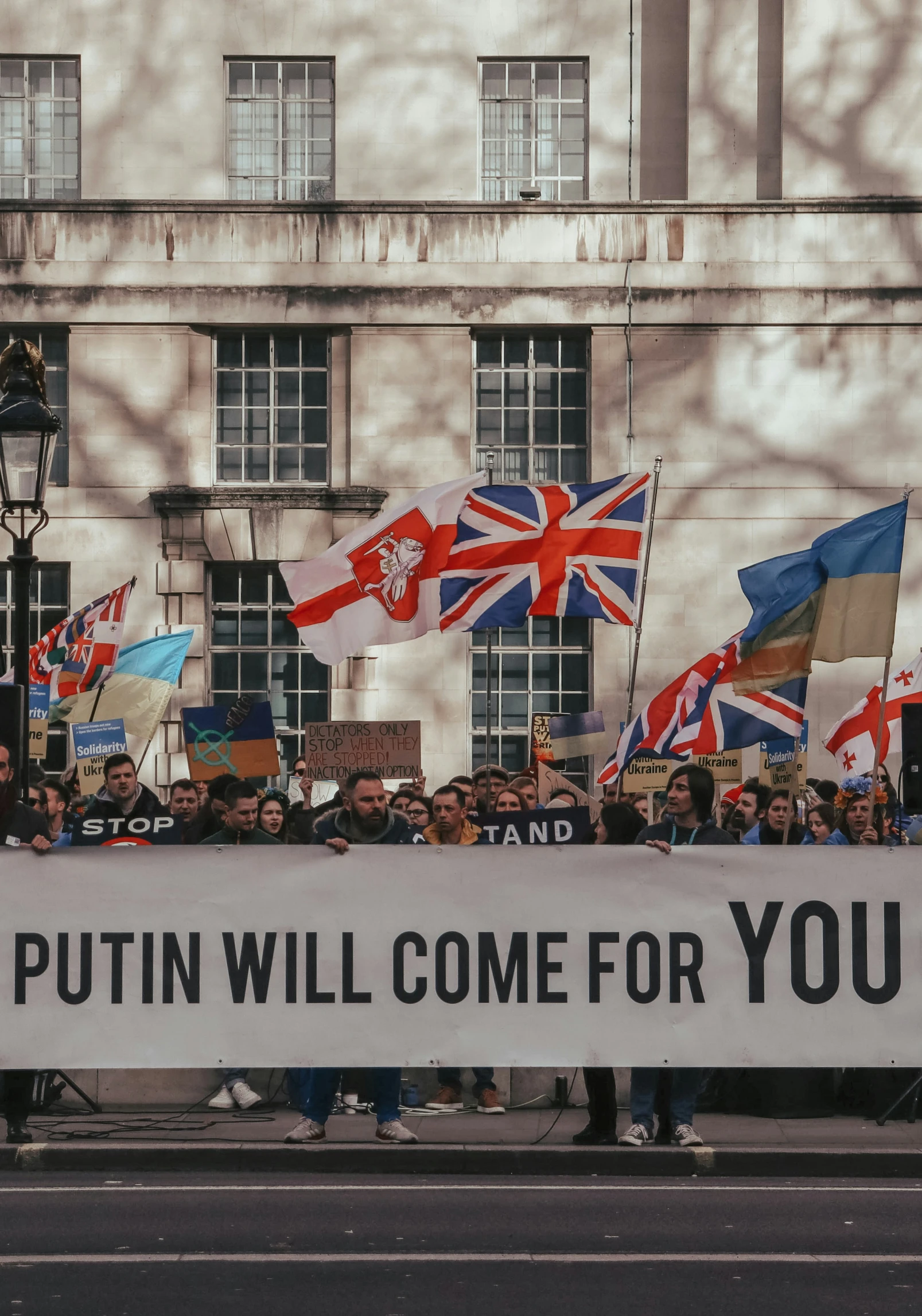 a group of people who are holding up a banner