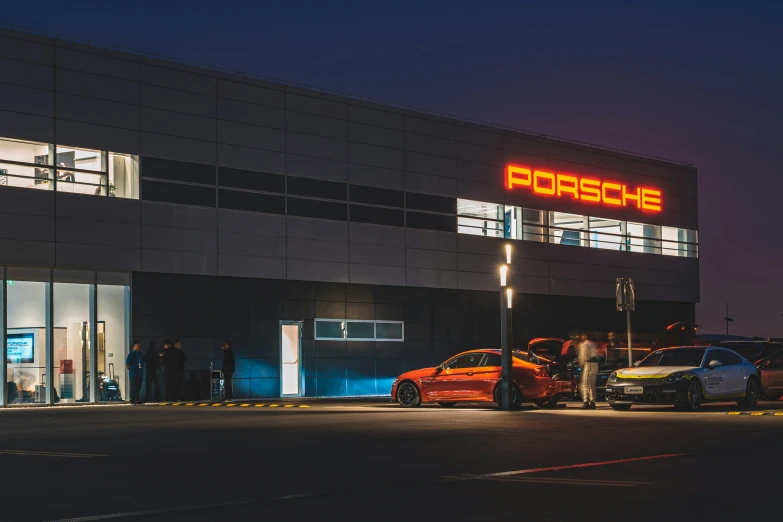 people getting inside of porsche automobile car dealership