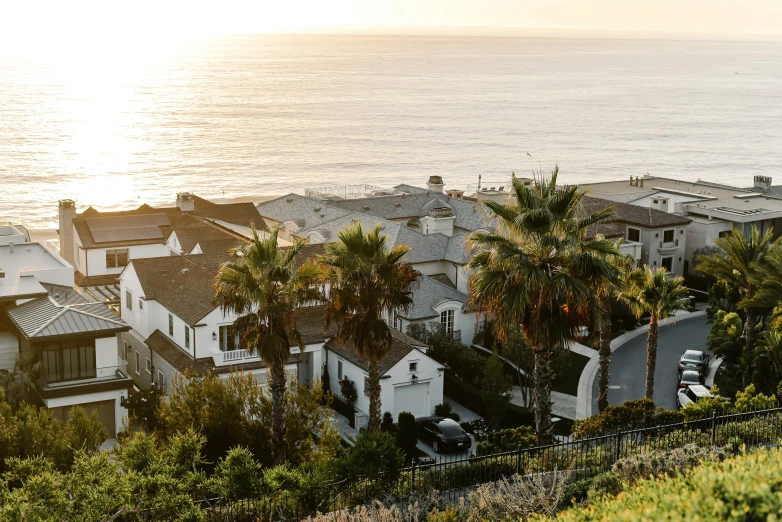 an image of a sunset or sunrise over some houses