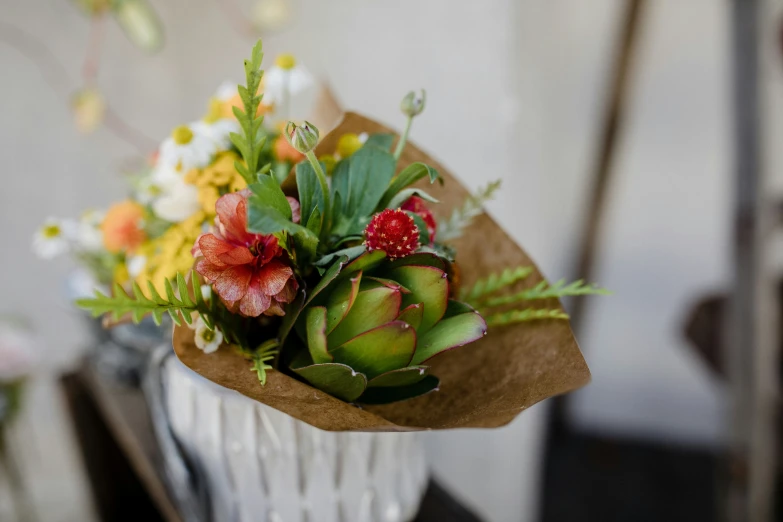 flowers in a vase, some green and some white