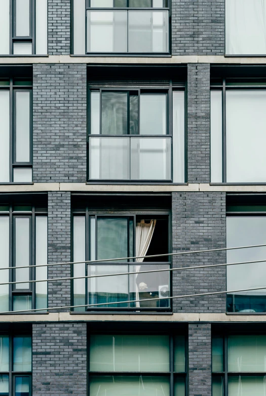 a building with windows and glass balconies