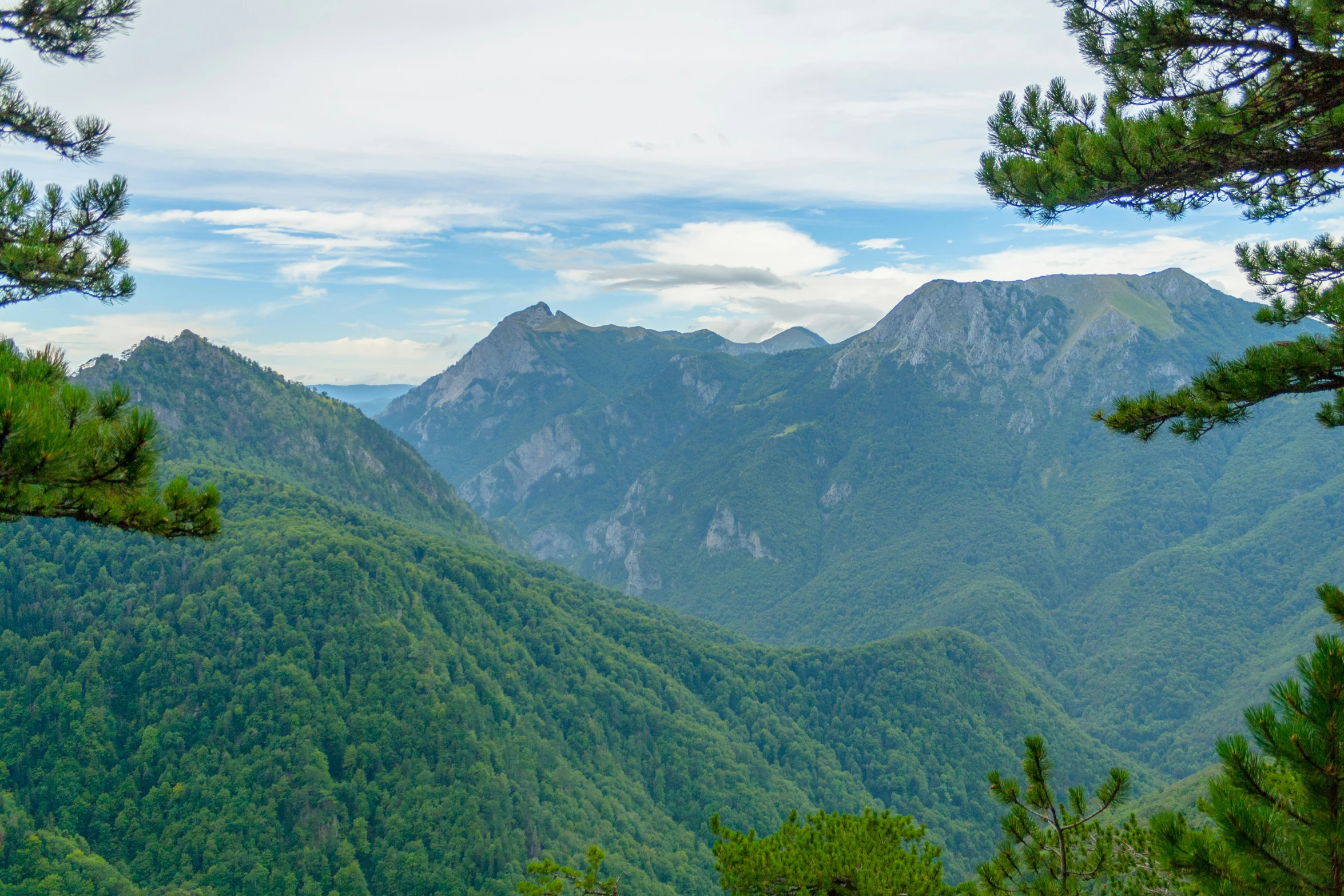 the mountains are shown from a distance on the trail