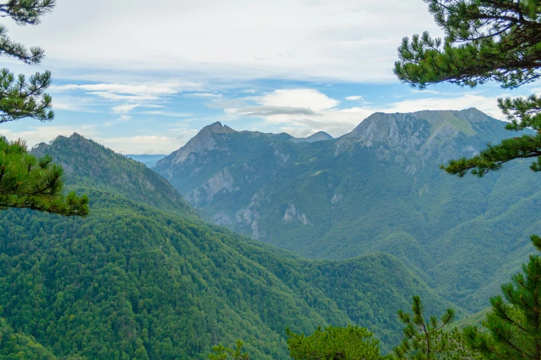 the mountains are shown from a distance on the trail