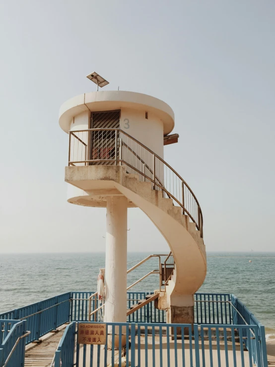 the stairs to a white house at the beach