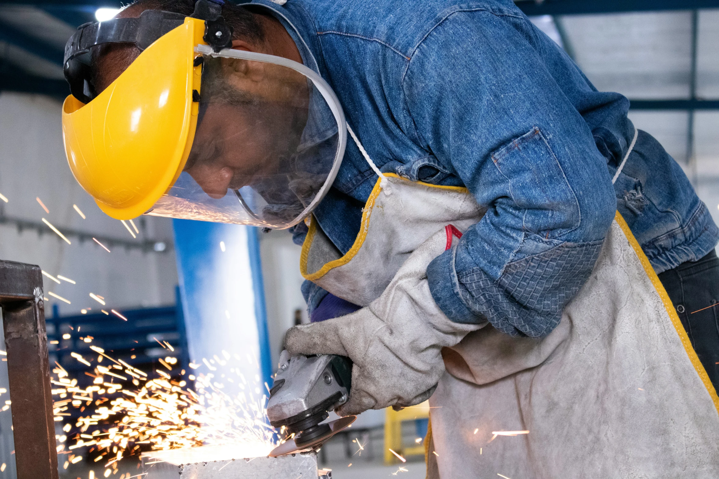 welder welding steel with protective goggles on