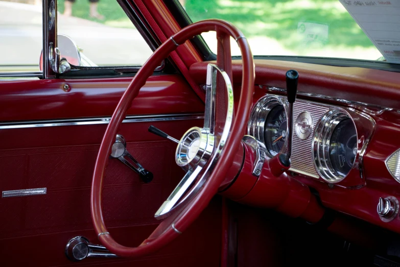 a view of the dashboard of a classic car