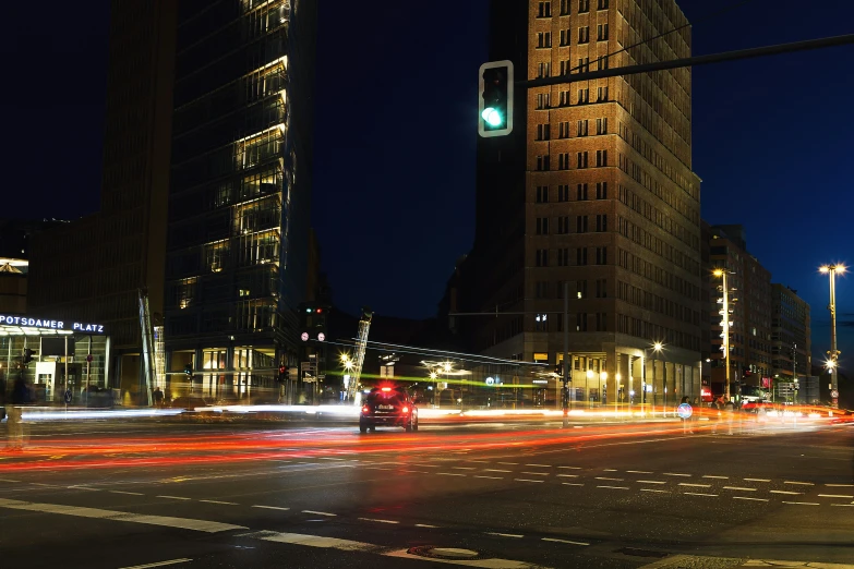 a city street filled with traffic at night