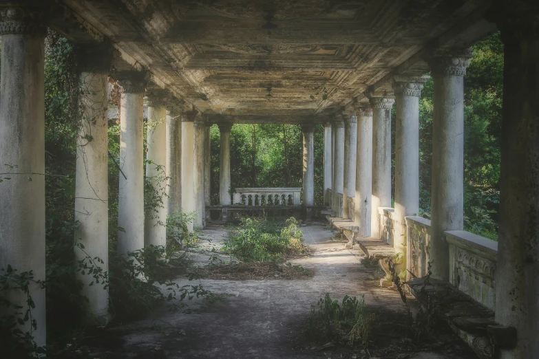 an empty park pavilion with many columns and seats