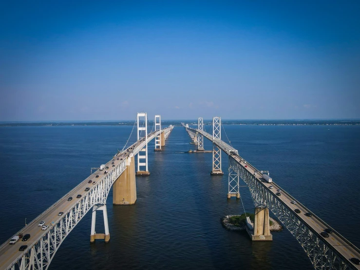 an overhanging view of a bridge spanning the ocean