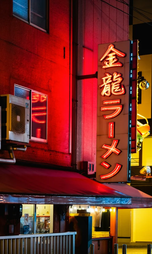 neon signs light up the city in oriental writing