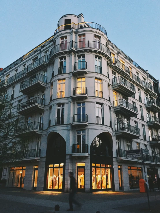 a building that is next to a person with a cell phone