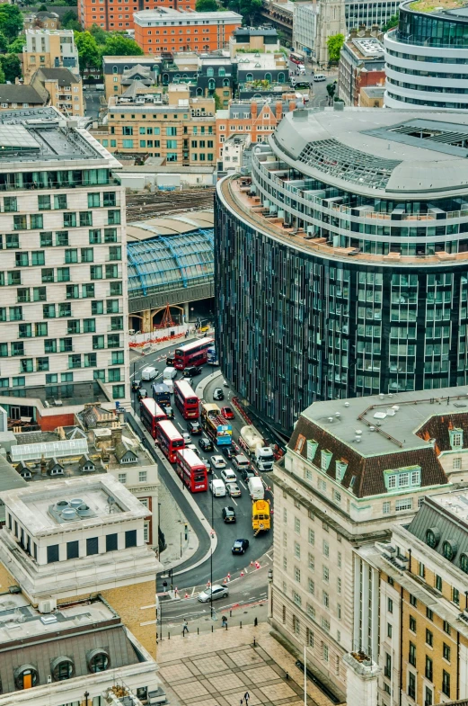 a view from the top of the building on the other side is the busy streets of a city