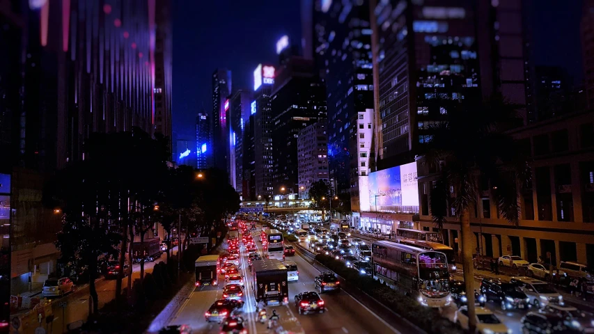 a night time city scene with lots of traffic