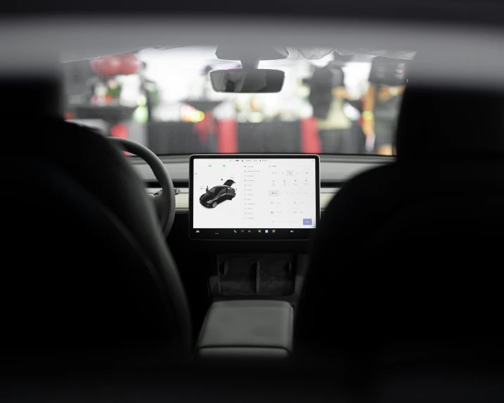 the dashboard of a car with an electronic screen on