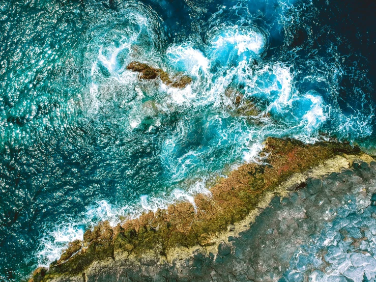 an aerial view of the ocean, from a plane