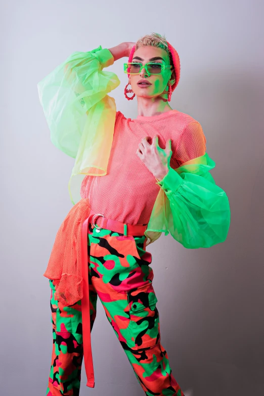 a woman posing with an umbrella over her head