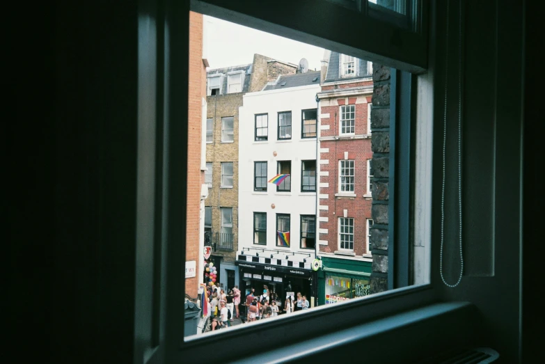 looking out of an open window at buildings