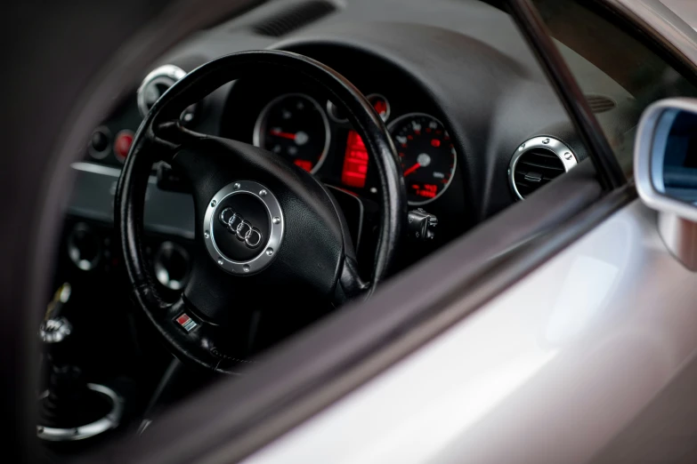 the steering wheel and dashboard of a car