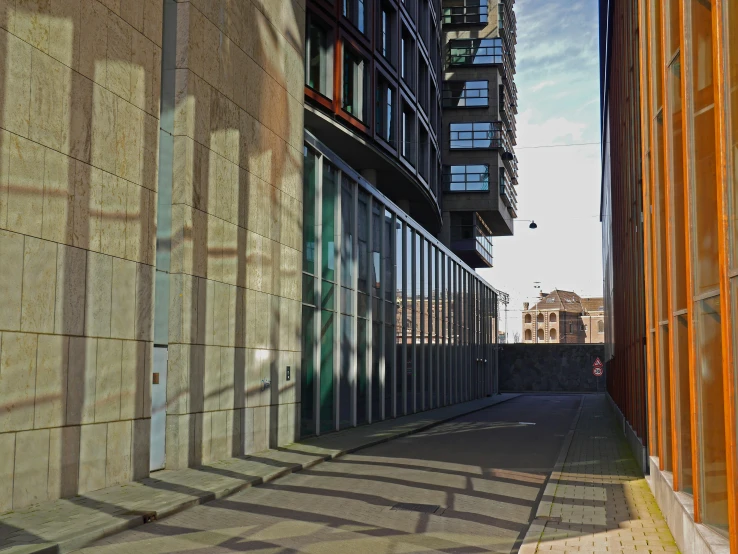 the shadows of buildings on the ground at sunset