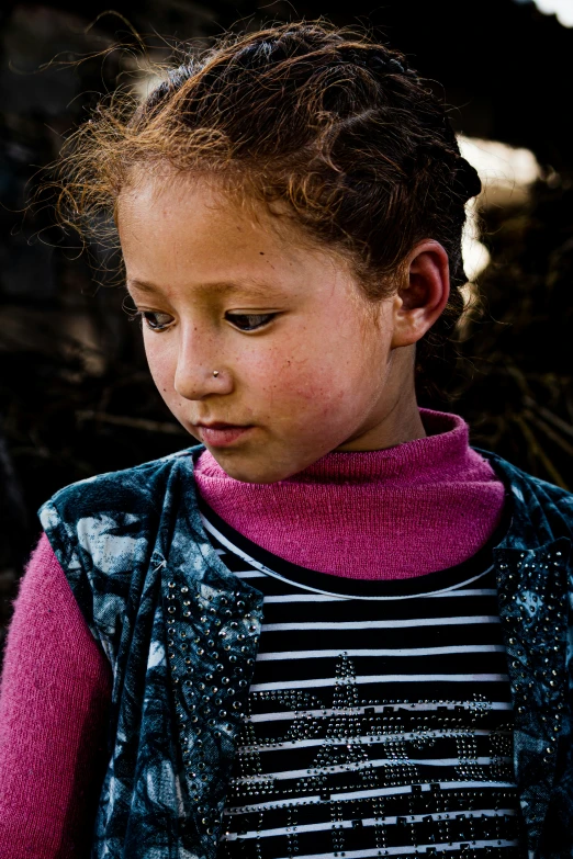 a girl holding a pizza in her hand