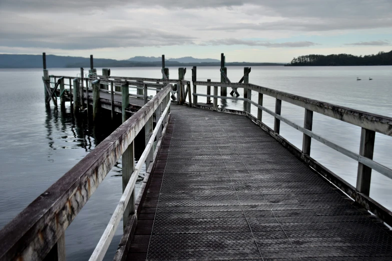 a view of a pier and calm water