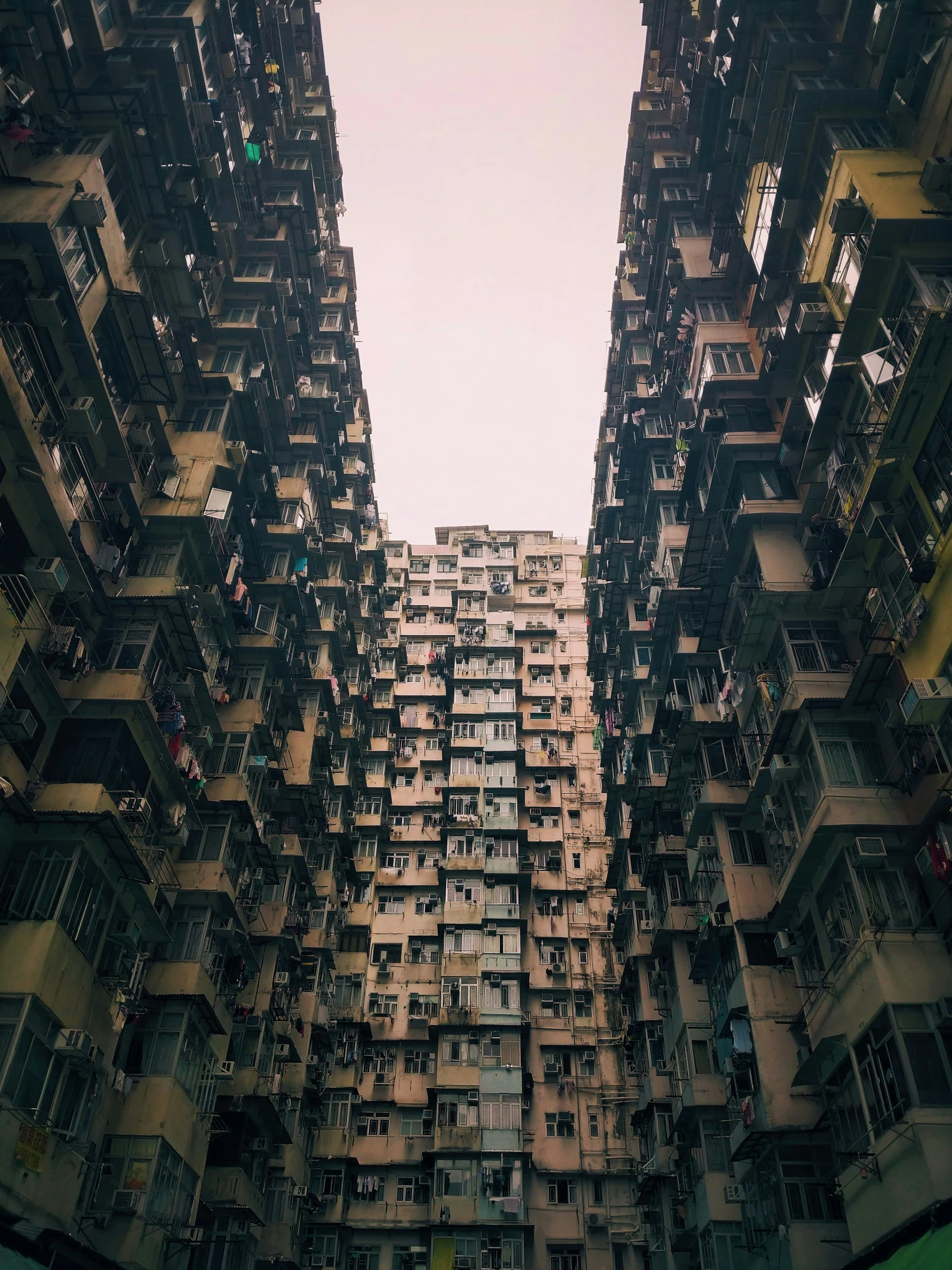 a cityscape looking up at an apartment building