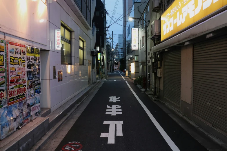 an image of a narrow road that is decorated with advertits