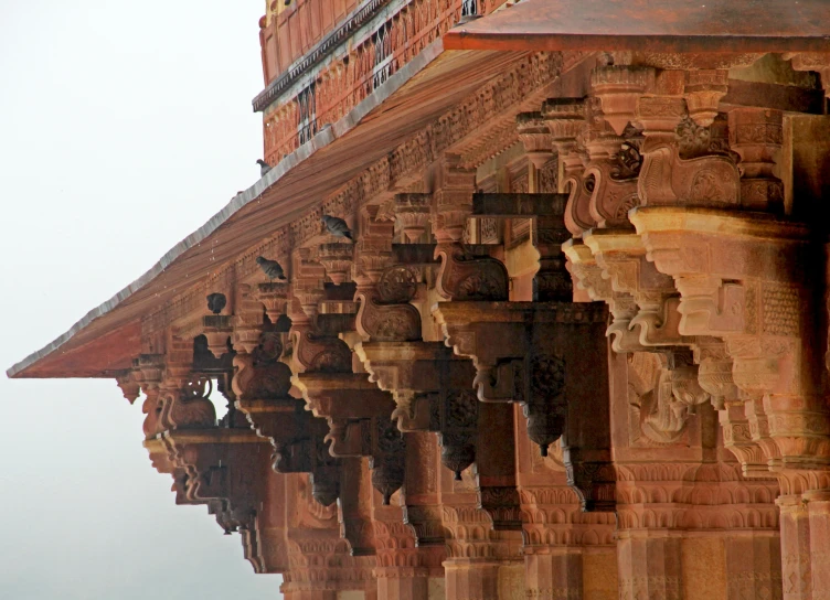 the corner of a building that has many intricately designed ornaments