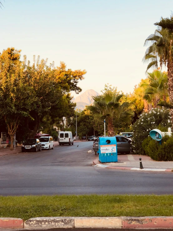 several vehicles parked at the entrance to a resort