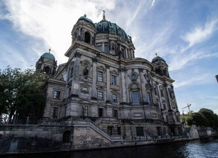 an old building with three towers on top of it