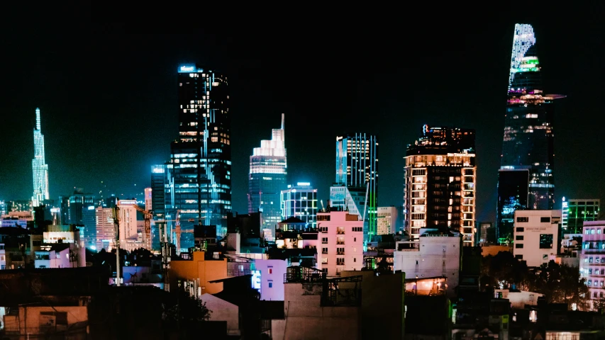 an image of a city skyline with lights and buildings
