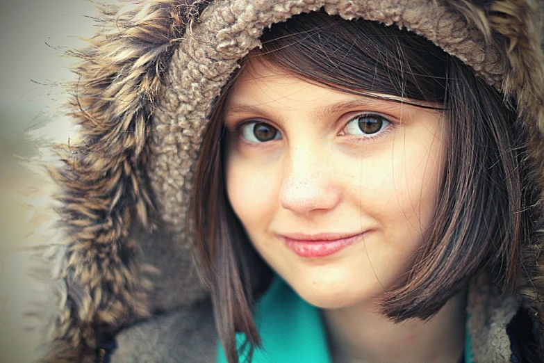 a close up of a woman wearing a fur hat