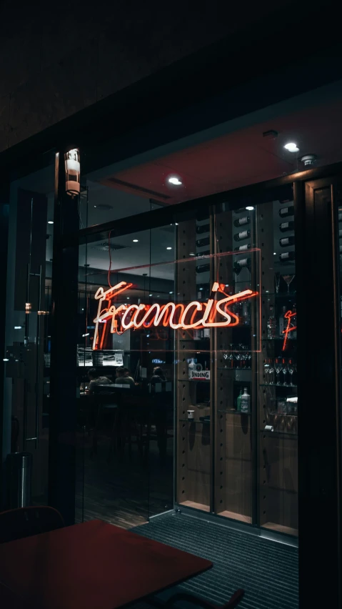 this is an image of a restaurant entrance with neon signage
