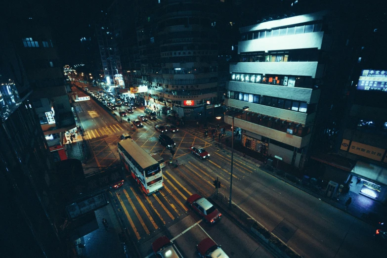 a view of a city at night from the top of a building