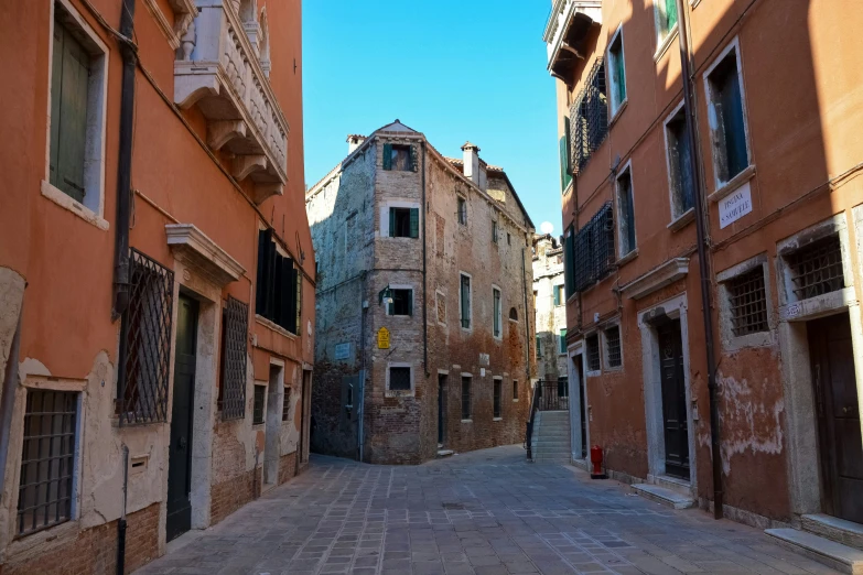 an alley way lined with building with windows