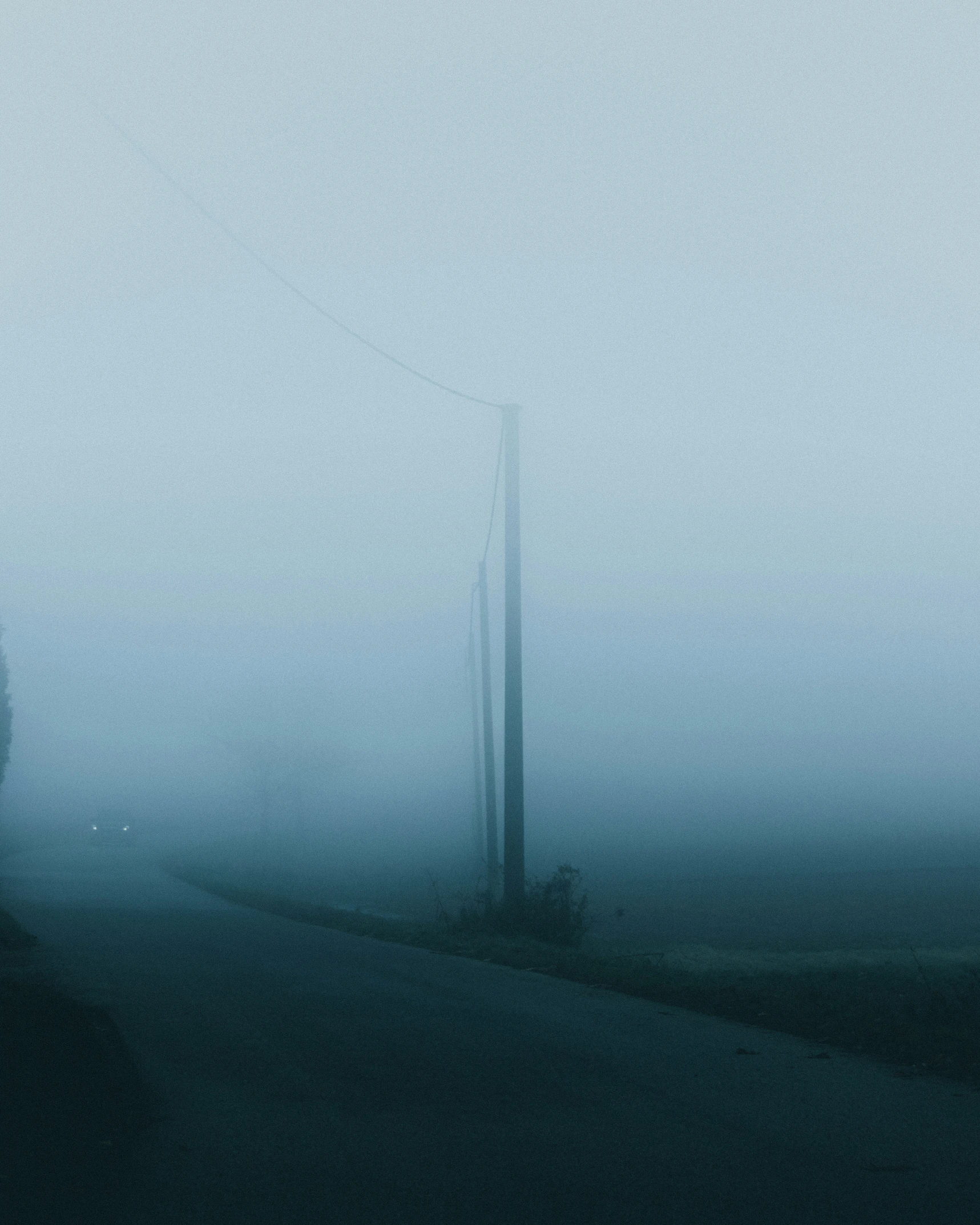 a bus driving on a foggy road