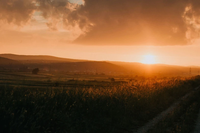 a po of the sun setting behind a mountain