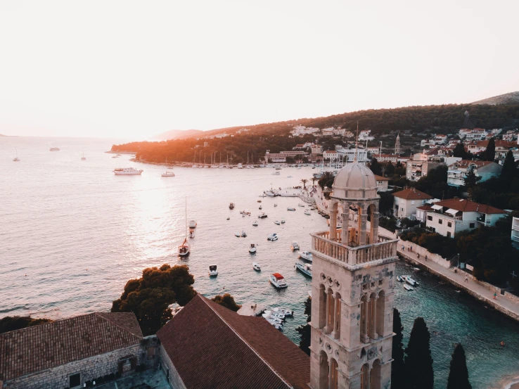 a church tower overlooking the ocean on a beautiful day