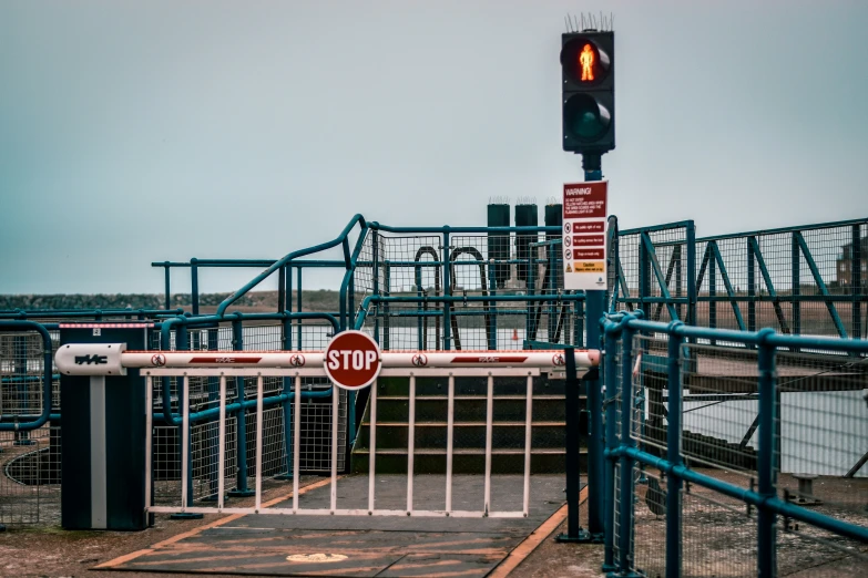 an open gate at the end of a construction site