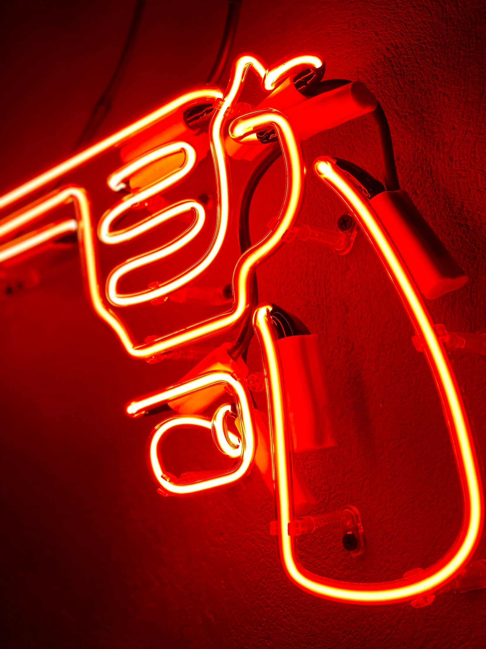 a red light shows the logo for a shooting gun shop