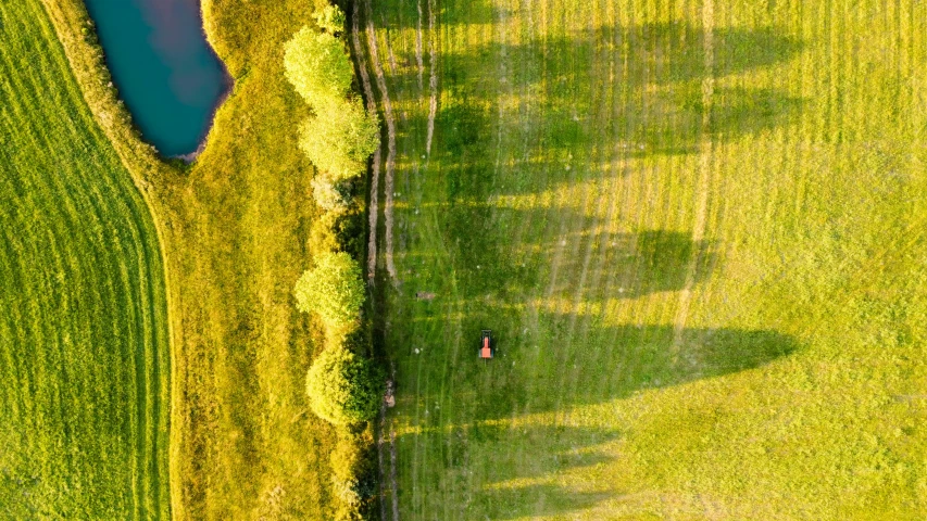 an aerial view of a large grassy field