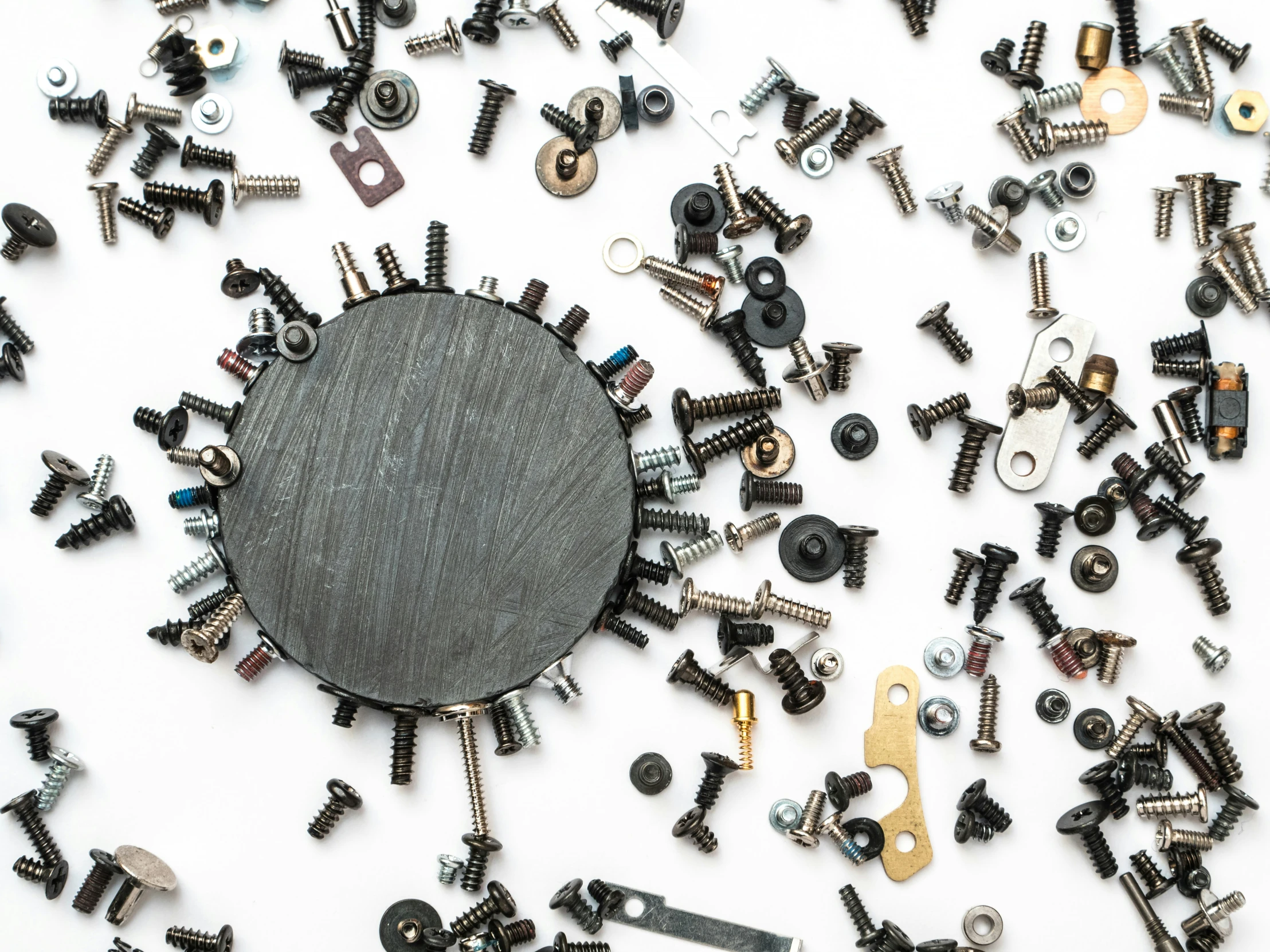 a black board with screws and other metal items