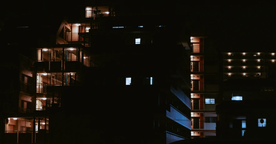 the side of buildings lit up in different shades at night