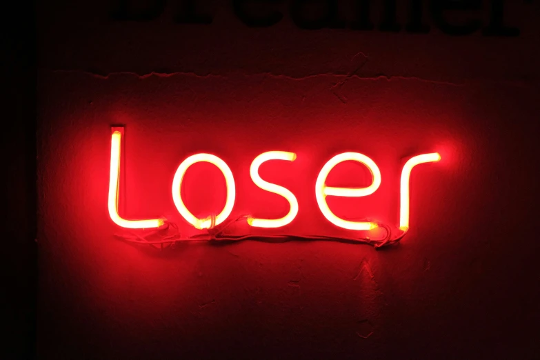a red neon sign that says closer