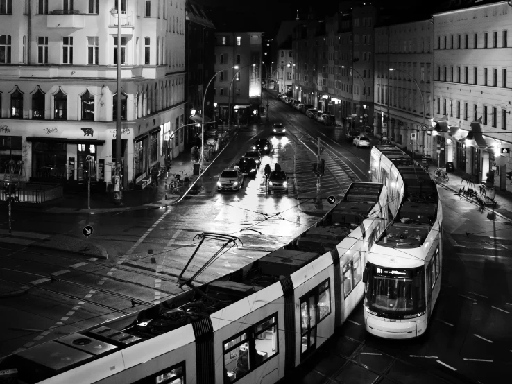 a street car going down the road with people walking around